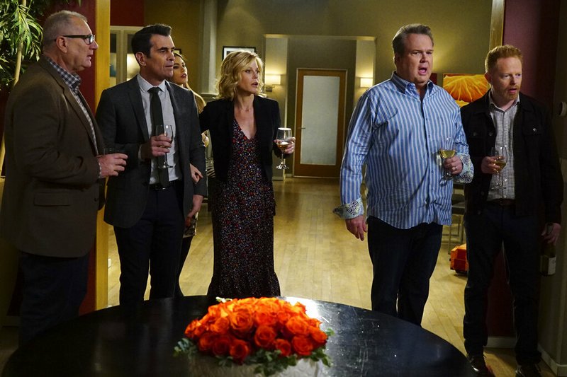 This image released by ABC shows, from left, Ed O'Neill, Ty Burrell, Sofia Vergara, obscured, Julie Bowen, Eric Stonestreet and Jesse Tyler Ferguson in a scene from "Modern Family." ABC's "Modern Family," the five-time Emmy Award winner for best comedy, will end its run next year after 11 seasons. ABC Entertainment President Karey Burke announced the end of the series about the boisterous extended family on Tuesday. (Richard Cartwright/ABC via AP)