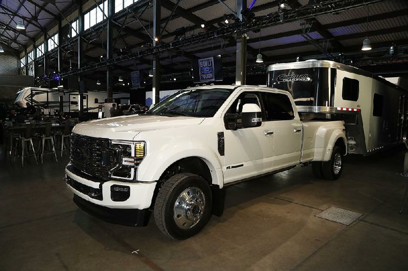 A Ford F-450 limited edition pickup sits on display last month in Detroit. Pickups from the three Detroit automakers were the top selling vehicles last year.