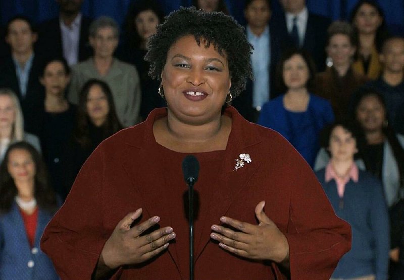 In this pool image from video, Stacey Abrams delivers the Democratic party's response to President Donald Trump's State of the Union address, Tuesday, Feb. 5, 2019 from Atlanta.  Abrams narrowly lost her bid in November to become America's first black female governor, and party leaders are aggressively recruiting her to run for U.S. Senate from Georgia. 
