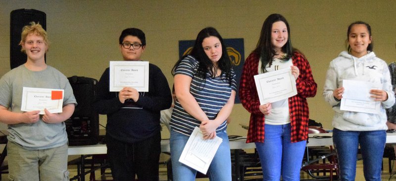 Westside Eagle Observer/MIKE ECKELS Eighth-grade students display their Character Awards during Decatur Middle School's Honors Awards assembly held in the high school cafeteria Jan. 18.
