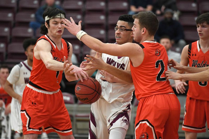 NWA Democrat-Gazette/J.T. WAMPLER Waldron's Mason Ford (Left) and Jacob Avila struggle for the ball with Lincoln's Malik Bagsby Tuesday Jan. 29, 2019. Waldron won 69-59.