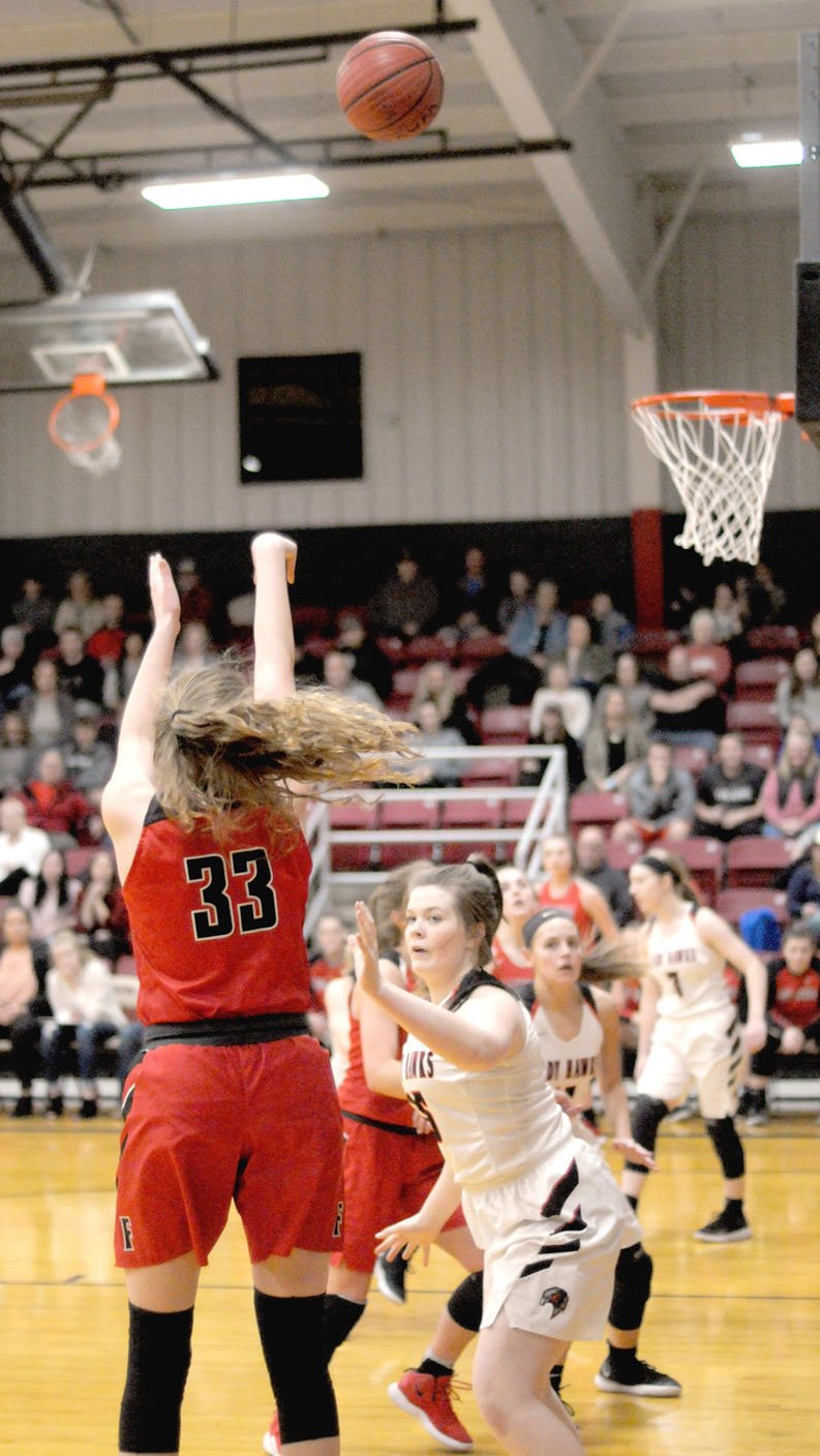 MARK HUMPHREY ENTERPRISE-LEADER Farmington junior Joelle Tidwell surprises Pea Ridge by swishing a 3-pointer during a Tuesday, Jan. 29 conference game. Pea Ridge defeated the Lady Cardinals, 63-60, in overtime.