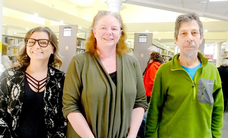 Lynn Atkins/The Weekly Vista Ruth Hyatt (center) poses with Bella Vista Friends of the Library president Ashley Jones and vice president Brian Kelly.