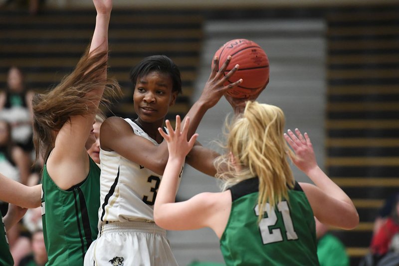 NWA Democrat-Gazette/J.T. WAMPLER Bentonville's Maryam Dauda looks for help under pressure from Van Buren's Rylee Ryan (21) Tuesday Feb. 5, 2019 at Tiger Stadium. Bentonville won 73-36 to secure a place in the Class 6A state tournament with five games remaining. Full coverage at http://nwadg.com #ARPreps