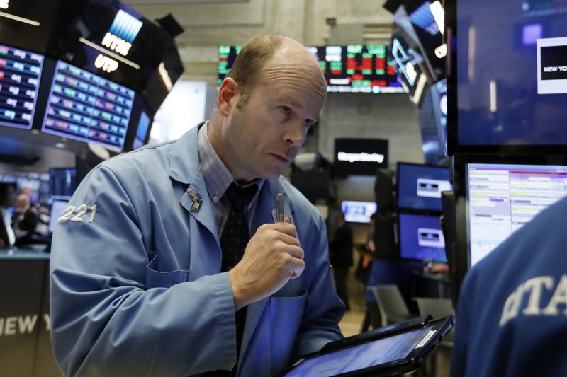 Trader Peter Mancuso works on the floor of the New York Stock Exchange, Tuesday, Feb. 5, 2019. Stocks are opening higher on Wall Street as investors welcomed some strong earnings reports from U.S. companies. (AP Photo/Richard Drew)