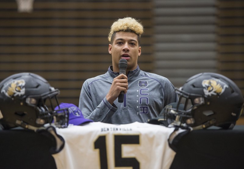 Donte Jones, Bentonville football player, makes remarks before signing his national letter of intent to play at Central Arkansas Wednesday, Feb. 6, 2019, during a signing ceremony at Bentonville's Tiger Arena. NWA Democrat-Gazette/BEN GOFF @NWABENGOFF