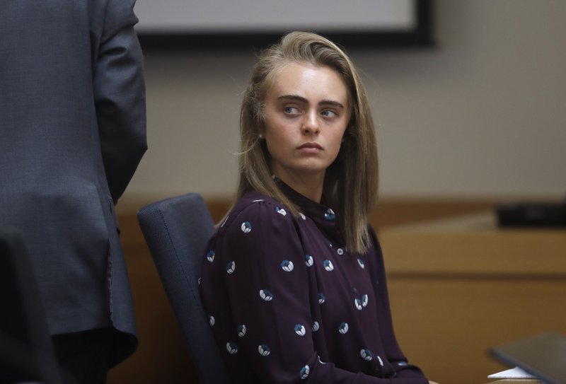 FILE - In this June 8, 2017 file photo, Michelle Carter sits in Taunton District Court in Taunton, Mass. Carter was convicted of involuntary manslaughter and sentenced to prison for encouraging 18-year-old Conrad Roy, III to kill himself in July 2014. The Supreme Judicial Court of Massachusetts is expected to release it's ruling in the case on Wednesday, Feb. 6, 2019. Her sentence was put on hold while the court reviewed the case and the defense argument that her actions were not criminal. (AP Photo/Charles Krupa, Pool, File)

