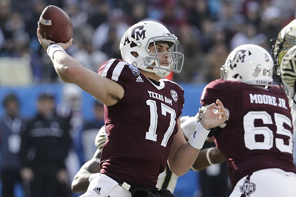 FILE — Texas A&M's Nick Starkel (17) looks to pass against Wake Forest during the first half of the Belk Bowl NCAA college football game in Charlotte, N.C., Friday, Dec. 29, 2017. (AP Photo/Chuck Burton)