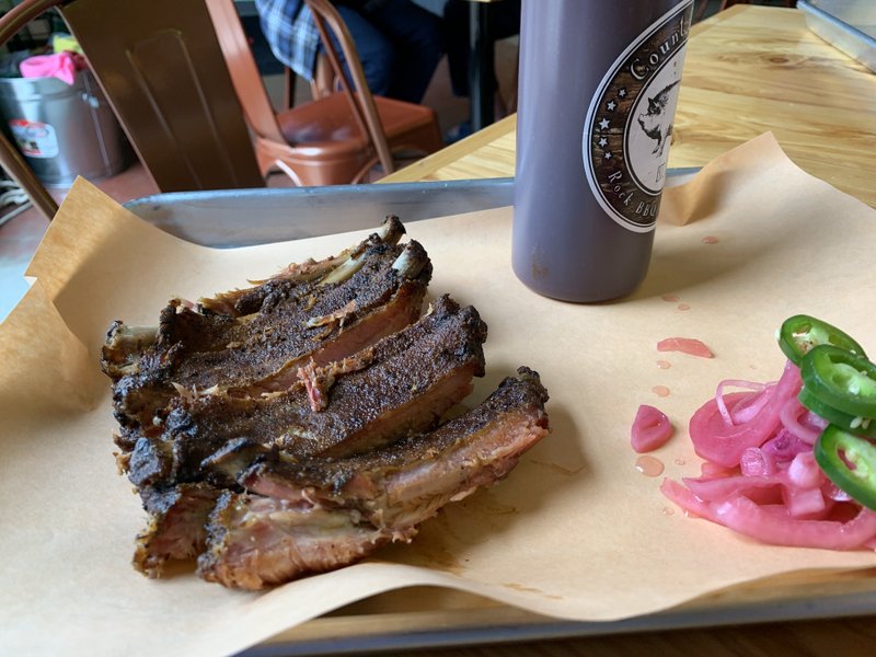 A quarter rack of ribs with pickled onions and fresh jalapenos on the side at Count Porkula.