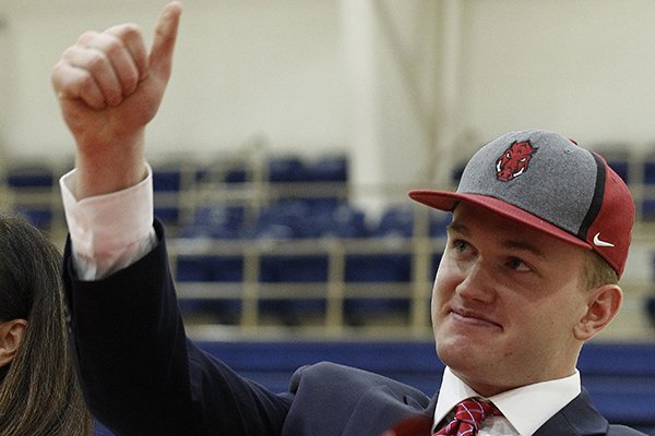 Pulaski Academy tight end Hudson Henry gives the thumbs up after signing a national letter of intent to play for the University of Arkansas during the PA signing day on Wednesday, Feb. 6, 2019, at Pulaski Academy in Little Rock.