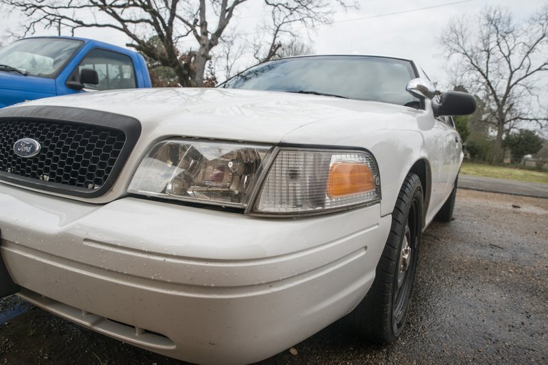 A former Taylor Police cruiser sits in front of the town’s water office.