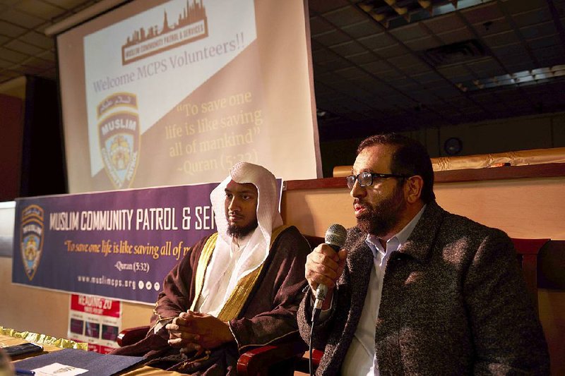 Sami Razi (right), president of Muslim Community Patrol & Services, and Imam Nazrul Islam, a member, speak before a training session at Al-Madinah School in Brooklyn. As the patrol makes plans for eventual citywide expansion, it faces backlash from communities including the one it’s been created to help protect. 