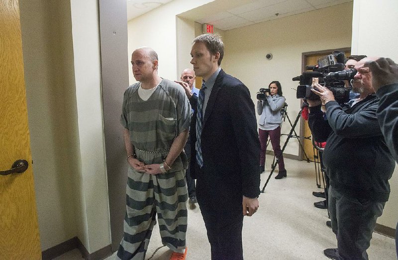 Grant Hardin walks into court Thursday with Benton County deputy public defender Kevin Lammers at the county courthouse in Bentonville.