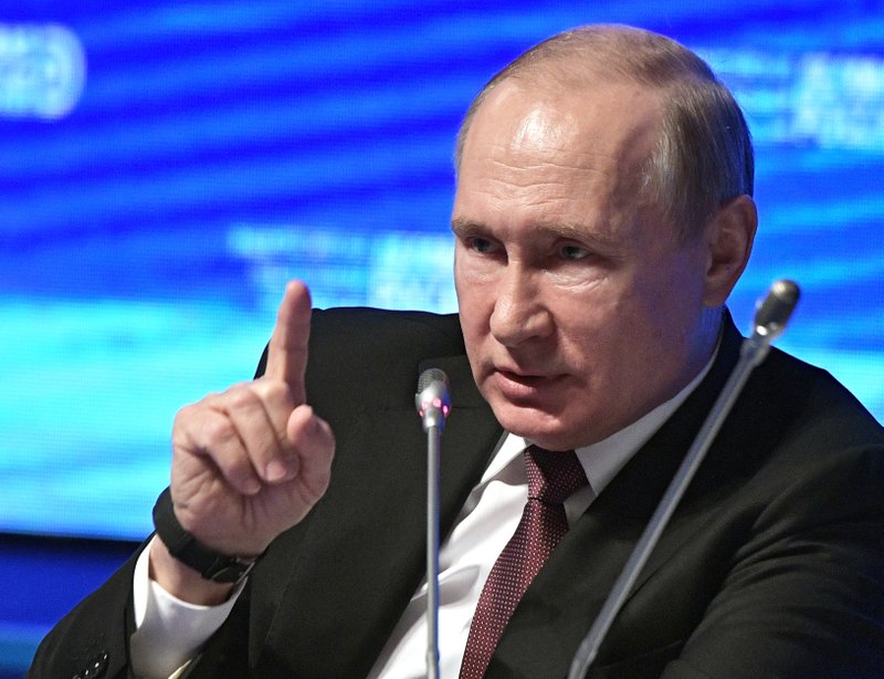 Russian President Vladimir Putin makes a point as he speaks at the plenary session of the Business Russia forum in Moscow, Russia, Wednesday, Feb. 6, 2019. (Alexei Nikolsky, Sputnik, Kremlin Pool Photo via AP)