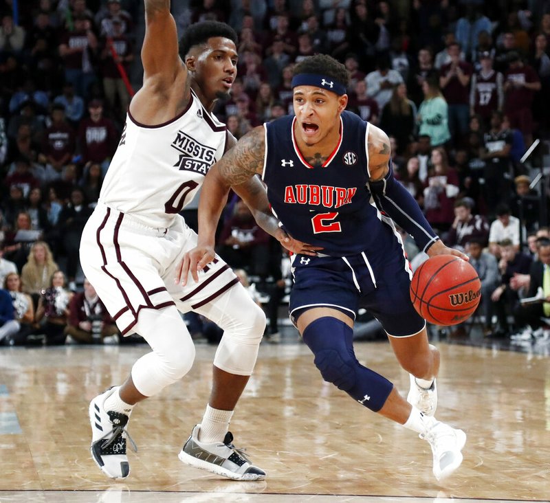 Auburn guard Bryce Brown (2) dribbles against Mississippi State guard Nick Weatherspoon (0) during the second half of an NCAA college basketball game in Starkville, Miss., Saturday, Jan. 26, 2019. (AP Photo/Rogelio V. Solis)