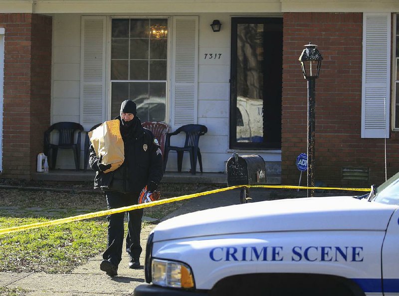 Little Rock police gather evidence Friday at a home in the 7300 block of Fairways Drive after responding to a 911 call there around 12:30 a.m. The caller reported an armed, masked intruder in the residence. Officers found a 34-year-old man fatally shot inside the home. 