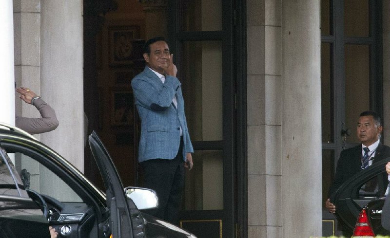 Thai Prime Minister Prayuth Chan-ocha leaves the government house Friday in Bangkok. 