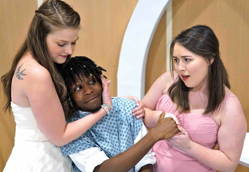 Photo courtesy Suzanne M. Thomas The cast says not laughing has been the biggest challenge during rehearsals for "Happily Ever After," a romantic comedy opening Valentine's Day at Fort Smith Little Theatre. Here, two deluded women (Victoria Walden, left, and Morgan Henderson, right) battle for the attention of Gert Fleers (Randall Marks), a mystery man who has caused a lot of uproar.