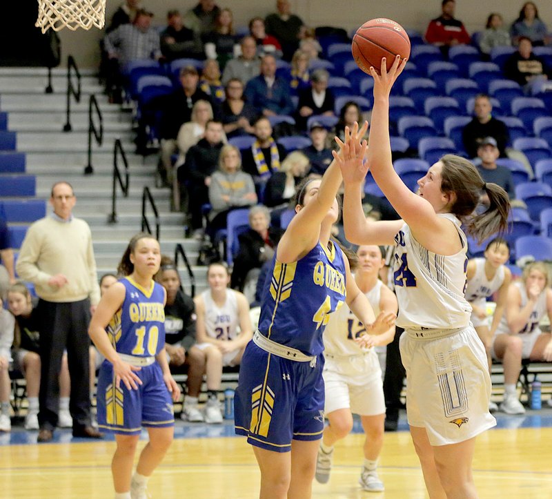 Photo courtesy of John Brown University John Brown women's basketball senior Baily Cameron shoots over Wayland Baptist's Kelea Pool during Thursday's game at Bill George Arena. The seventh-ranked Flying Queens defeated JBU 71-68.