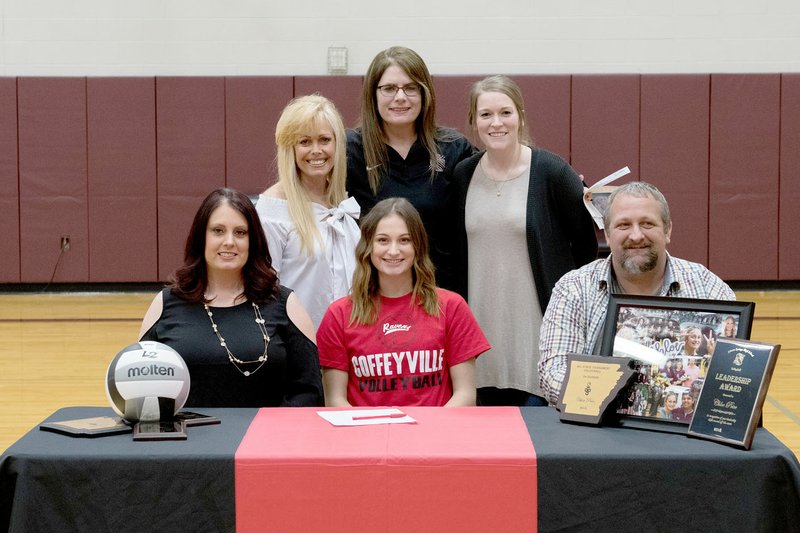 Bud Sullins/Special to Siloam Sunday Siloam Springs senior Chloe Price signed a letter of intent Wednesday to play volleyball at Coffeyville (Kan.) Community College. Pictured are: Front from left, mother Brandi Price, Chloe Price, father Larry Price; back, former Siloam Springs volleyball coach and Chloe Price's aunt, Rose Cheek-Willis; SSHS head coach Joellen Wright and assistant coach Kailey Greenleaf.