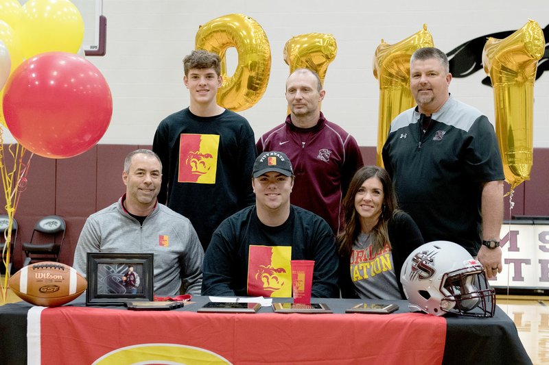 Bud Sullins/Special to Siloam Sunday Siloam Springs senior Corbin Collins signed a letter of intent Wednesday to play football at Pittsburg (Kan.) State University. Pictured are: Front from left, father John Collins, Corbin Collins and mother Carrie Collins; back, brother Camden Collins, Siloam Springs offensive line coach Jonathan Johnson and SSHS head coach Brandon Craig.