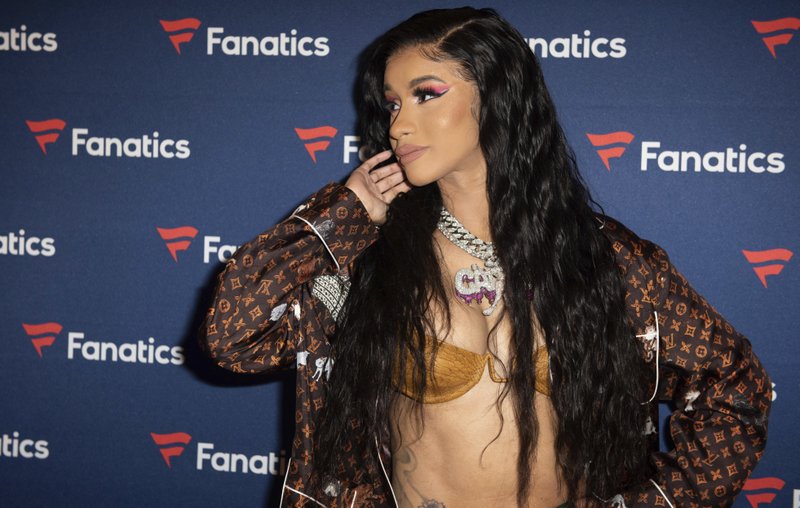 FILE - This Feb. 2, 2019 file photo, Cardi B arrives at the 2019 Fanatics Super Bowl Party in Atlanta. Even though Cardi B has a strong chance of winning her first-ever Grammy, the rapper says she is feeling nervous heading into the upcoming awards show.  (Photo by Paul R. Giunta/Invision/AP, File)