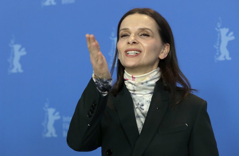 Jury president Juliette Binoche blows a kiss as she poses for the photographers during a photo call at the 2019 Berlinale Film Festival in Berlin, Germany, Thursday, Feb. 7, 2019. (AP Photo/Michael Sohn)