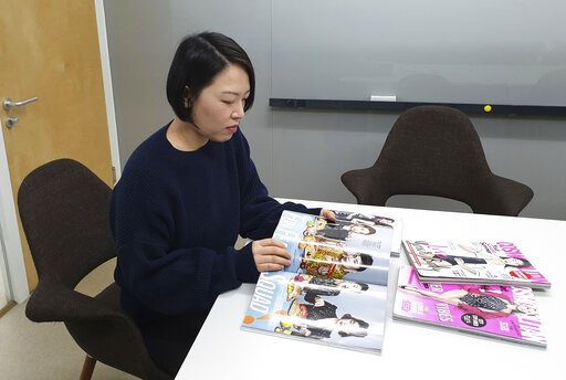 The Associated Press BEAUTY STANDARDS: In this Jan. 23 photo, Park Jiehyun, feature&#8203;s director at Cosmopolitan Korea, watches fashion magazine during an interview in Seoul, South Korea. South Korea has the world's highest ratio of plastic surgeons per capita, according to a report by the International Society of Plastic Surgery in 2016. According to 2015 statistics by Gallup Korea, about one third of South Korean women between 19 and 29 said they've had plastic surgery. "I think (South Korean women) want to look perfect," said Park Jiehyun, feature&#8203;s director at Cosmopolitan Korea, a popular fashion magazine. "They believe they should have a nice body and skin, beautiful eyes, nose and mouth, and even sleek hair with a perfect hairline. They also want to have good style." But Park says rising feminist movements and changing values among South Korean women are redirecting her industry's depiction of beauty.