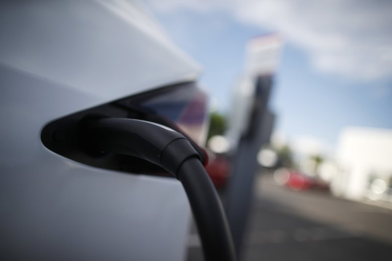 The Associated Press MODEL X: In this May 27, 2018, photo a 2018 Model X is plugged into a charging station at a Tesla dealership in Littleton, Colo. Cold temperatures can sap electric car batteries, temporarily reducing their range by more than 40 percent when interior heaters are used, a new study found. The study of five electric vehicles by AAA also found that high temperatures can cut into battery range, but not nearly as much as the cold. The range returns to normal in more comfortable temperatures.