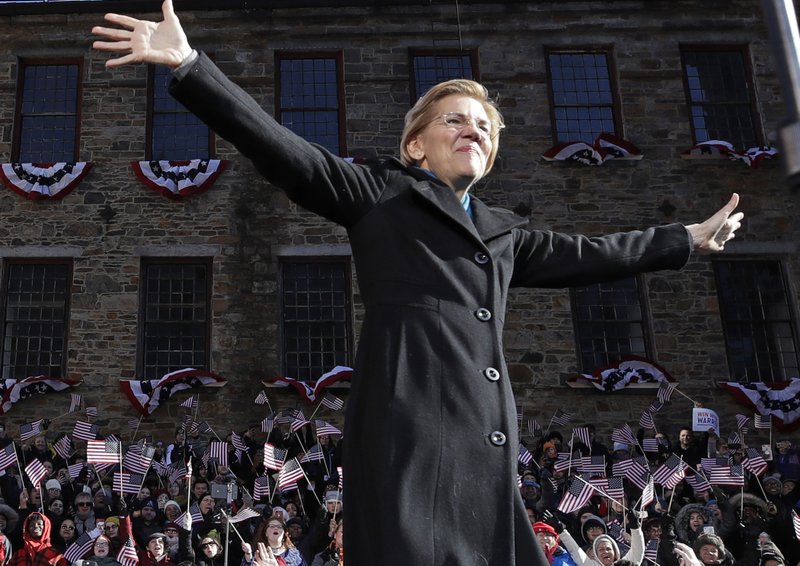 Sen. Elizabeth Warren, D-Mass., acknowledges cheers as she takes the stage during an event to formally launch her presidential campaign, Saturday, Feb. 9, 2019, in Lawrence, Mass. (AP Photo/Elise Amendola)