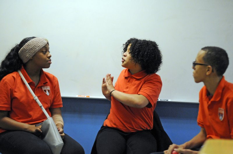 In this Nov. 15, 2018 photo, students participate in a Youth Aware of Mental Health session at Uplift Hampton Preparatory School in Dallas. University of Texas Southwestern Medical Center offers the program to schools to help educate students about mental health and suicide prevention. Part of the program includes the students participating in role-playing sessions to help them understand the issues being discussed. (AP Photo/Benny Snyder)