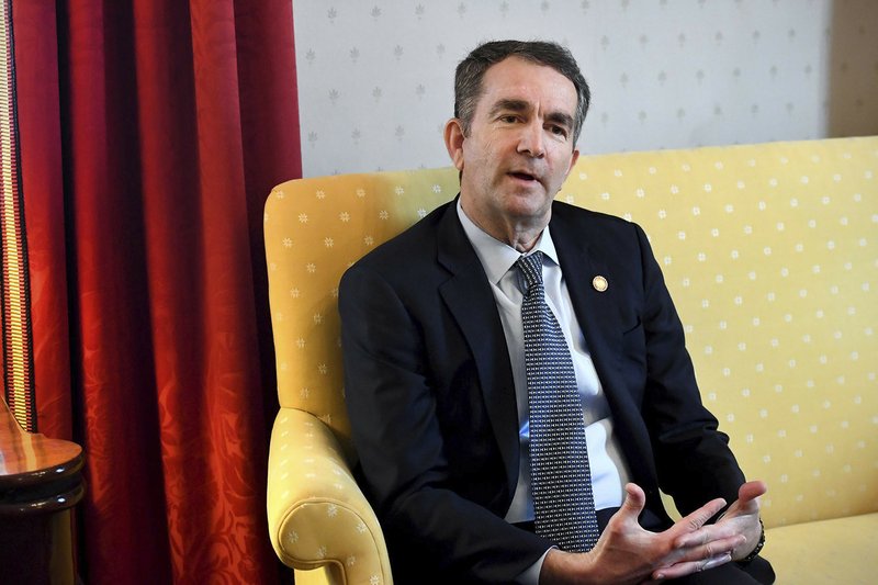 Virginia Gov. Ralph Northam talks during an interview at the Governor's Mansion, Saturday, Feb. 9, 2019 in Richmond, Va. The embattled governor says he wants to spend the remaining three years of his term pursuing racial &quot;equity.&quot; Northam told The Washington Post that there is a higher reason for the &quot;horrific&quot; reckoning over a racist photograph that appeared in his medical school yearbook. (Katherine Frey/The Washington Post via AP)