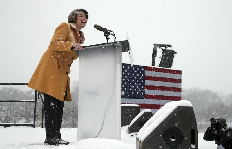 Democratic Sen. Amy Klobuchar addresses a snowy rally where she announced she is entering the race for president Sunday at Boom Island Park in Minneapolis. (AP Photo/Jim Mone)

