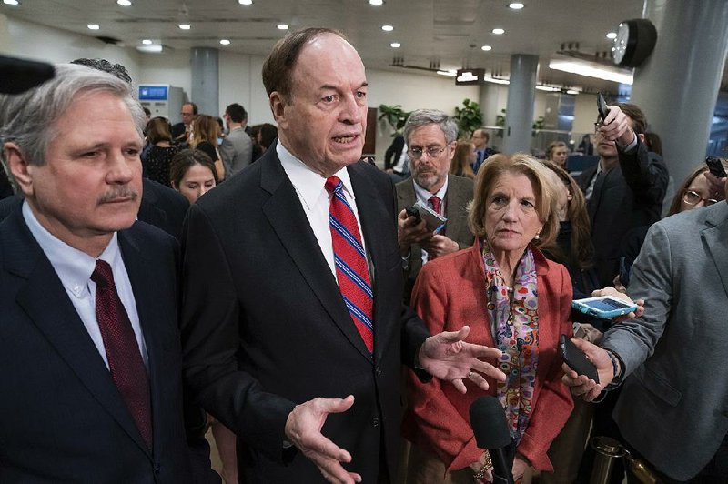 Sen. Richard Shelby, R-Ala., the top Republican on the bipartisan group bargainers working to craft a border security compromise in hope of avoiding another government shutdown, is joined by Sen. John Hoeven, R-N.D., left, and Sen. Shelley Moore Capito, R-W.Va., right, as they speak with reporters after a briefing with officials about the US-Mexico border, on Capitol Hill in Washington, Wednesday, Feb. 6, 2019. Shelby is chairman of the Senate Appropriations Committee.