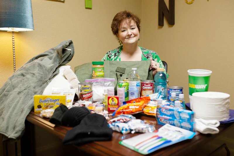 Naomi Bratton shows some of the items that HELP — Housing, Education and Life-Skills Program — has collected for the homeless in Cabot, Austin and Ward. HELP’s upcoming fundraiser, Chocolate HELPs, will assist the nonprofit in purchasing a building for a transitional living facility for the homeless and those at risk of being homeless.
