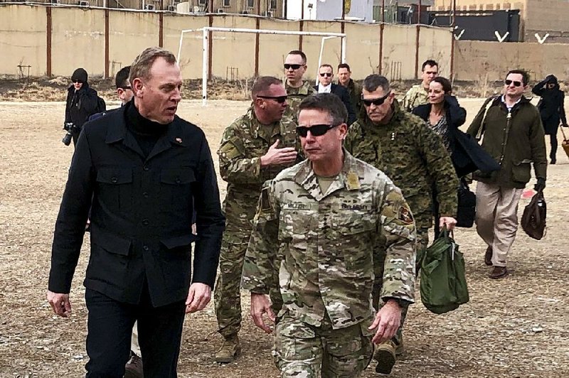 Acting Defense Secretary Pat Shanahan (left) arrives in Kabul, Afghanistan, on Monday to consult with Army Gen. Scott Miller (right), commander of U.S. and coalition forces, and with senior Afghan government leaders. 