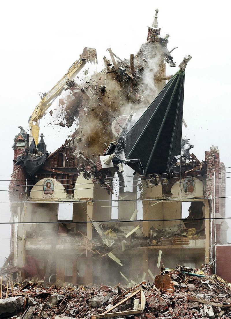 Saint Joseph’s Church in Nanticoke, Pa., is demolished Monday, by Brdaric Excavating. The Scranton Diocese decided to tear down the church after attempts to sell the building, which has been vacant since 2010. 