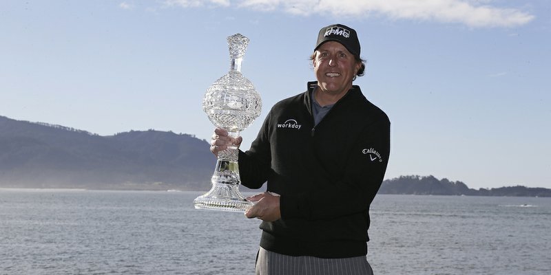 The Associated Press PEBBLE NO. 5: Phil Mickelson poses with his trophy Monday on the 18th green of the Pebble Beach Golf Links after winning the AT&amp;T Pebble Beach Pro-Am golf in Pebble Beach, Calif.