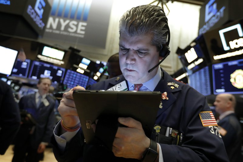FILE- In this Feb. 5, 2019, file photo trader John Panin works on the floor of the New York Stock Exchange. The U.S. stock market opens at 9:30 a.m. EST on Monday, Feb. 11. (AP Photo/Richard Drew, File)
