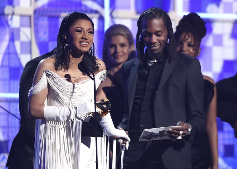 Cardi B, left, accepts the award for best rap album for &quot;Invasion of Privacy&quot; as Offset looks on at the 61st annual Grammy Awards on Sunday, Feb. 10, 2019, in Los Angeles. (Photo by Matt Sayles/Invision/AP)