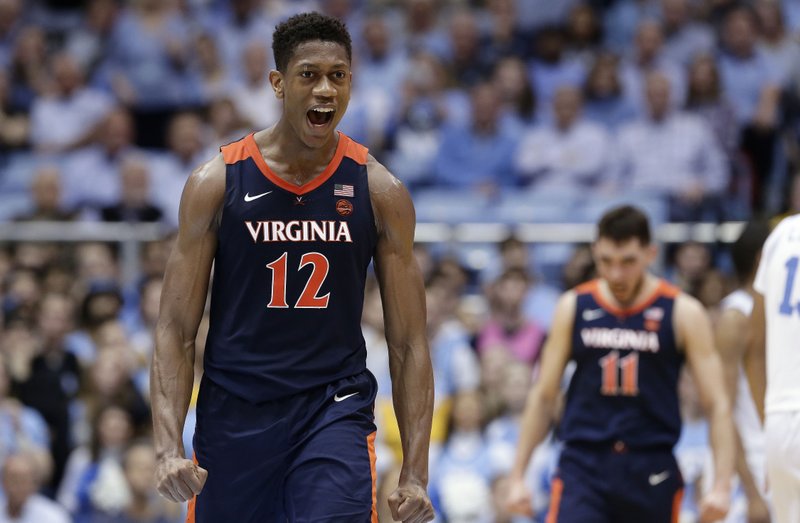 Virginia's De'Andre Hunter (12) reacts following a win over North Carolina following an NCAA college basketball game in Chapel Hill, N.C., Monday, Feb. 11, 2019. (AP Photo/Gerry Broome)