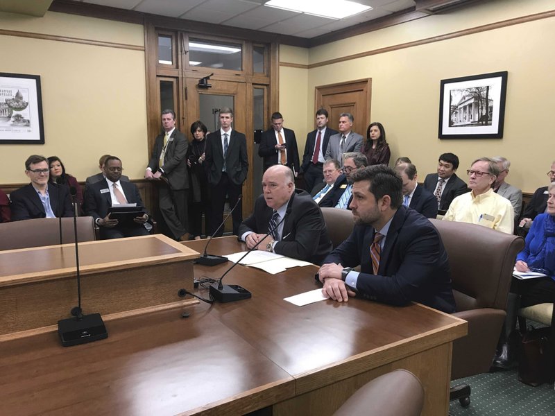 Arkansas Rep. Joe Jett, left, and Sen. Jonathan Dismang, right, speak to the House Revenue and Tax Committee at the state Capitol in Little Rock on Tuesday about a proposal to cut the state's top income tax rate. (AP Photo/Andrew DeMillo)

