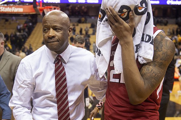 Arkansas head coach Mike Anderson, left, comforts player Gabe Osabuohien, right, after they lost 79-78 to Missouri in an NCAA college basketball game Tuesday, Feb. 12, 2019, in Columbia, Mo. (AP Photo/L.G. Patterson)