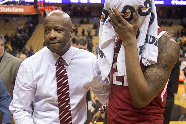 Arkansas head coach Mike Anderson, left, comforts player Gabe Osabuohien, right, after they lost 79-78 to Missouri in an NCAA college basketball game Tuesday, Feb. 12, 2019, in Columbia, Mo. (AP Photo/L.G. Patterson)

