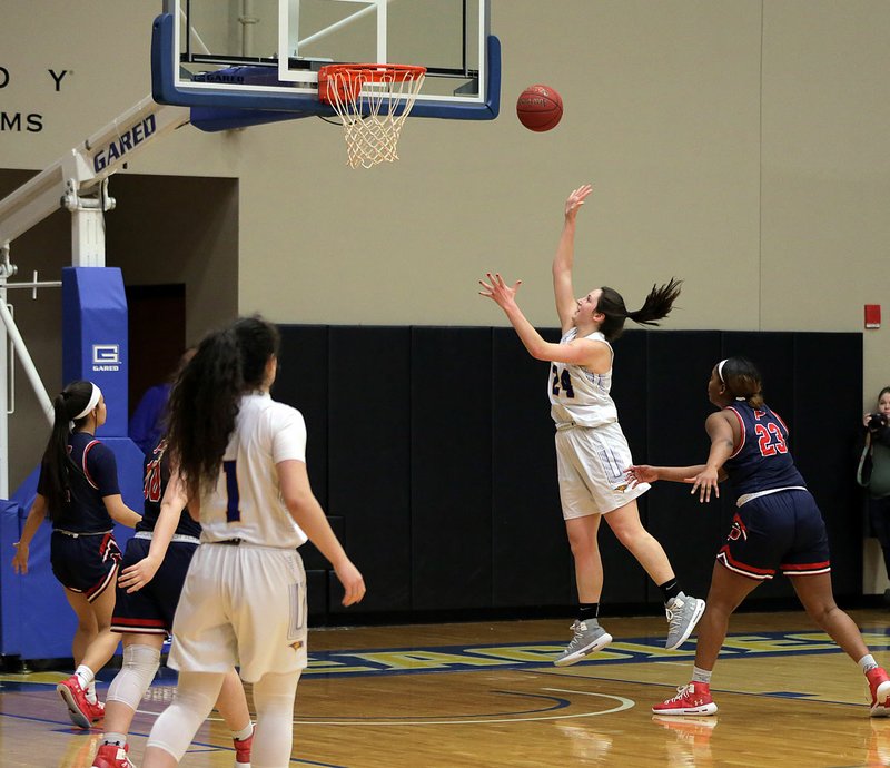 Photo courtesy of John Brown University John Brown senior Baily Cameron scores inside for two of her 26 points during last Saturday's 86-59 win over Panhandle State at Bill George Arena.