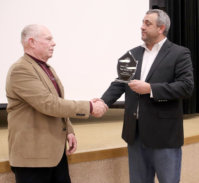 Former Prairie Grove City Council member Murph Pair, who owned a local business in Prairie Grove and was an active member of Prairie Grove Lions Club, was recognized at the chamber banquet with a Life Time Achievement Award for all his efforts in activities to benefit the community. Chamber President Dale Reed presented the award.