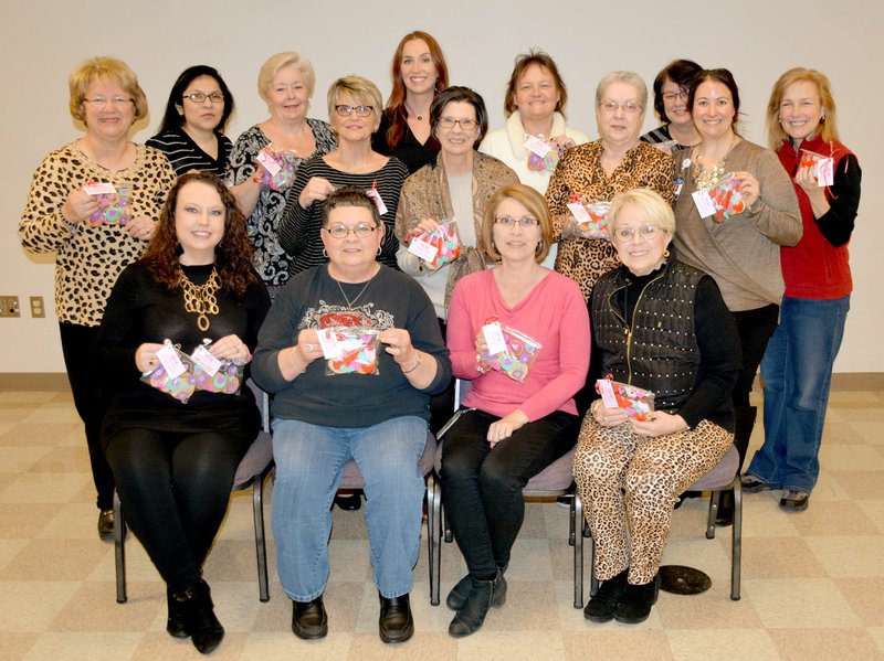 Janelle Jessen/Herald-Leader Members of the Siloam Springs and Gentry chapters of the Circle of Life Hospice Auxiliary gathered on Tuesday to put together more than 200 packages of Valentines cookies they baked for hospice staff members. The cookies will be distributed on Valentines day to hospice staff members at the Bentonville and Springdale locations as well as to mobile staff to thank them for their service, according to Kelly Horrell, giving manager for Circle of Life.