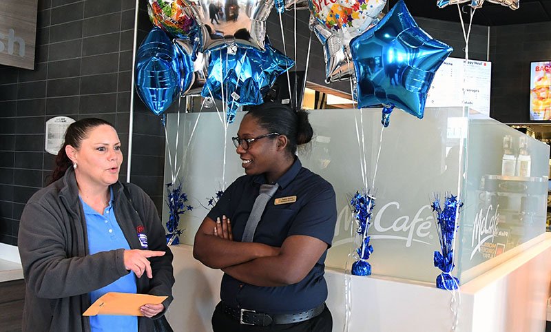 ROBERT LAMERA DAY: Last month, the local McDonald's locations raised $3,600 for Robert Lamera, an ill employee from the 1713 Airport Road location. On Tuesday, Lamera's wife, Sheila Lamera, left, spoke to Nakia Hatley, general manager of the Airport Road restaurant, after she was presented the money.