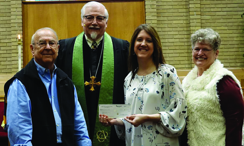 Pictured left to right, Ken Estes, Finance Chair, Rev. David Moore, Pastor, presenting a check to Hannah House Amanda Newton, Annette McClellan.