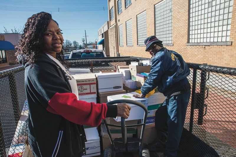 County employees load belongings and office equipment from the downtown Magnolia Annex Building Wednesday, as the move to the West Side Annex began. The new complex opens for regular business on Tuesday, Feb. 19. Until then, all annex offices will be closed for the relocation process.